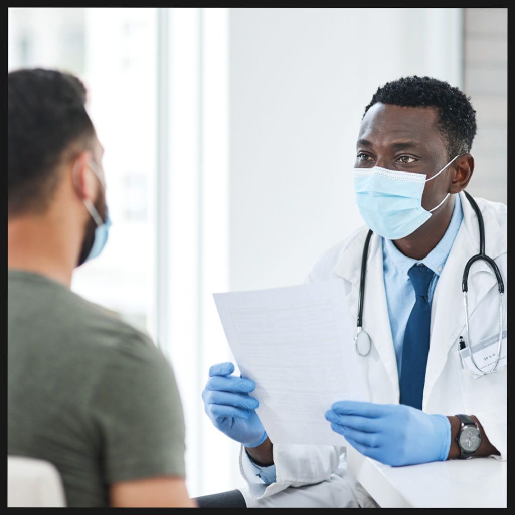 african american doctor speaking to a patient 